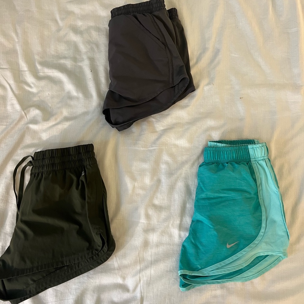 3 athletic shorts in different colors.